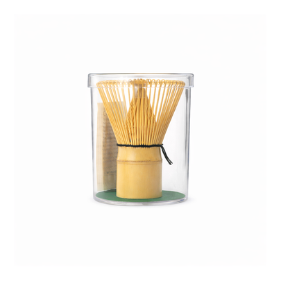 Traditional bamboo matcha whisk stored in a clear protective case to maintain shape and extend durability