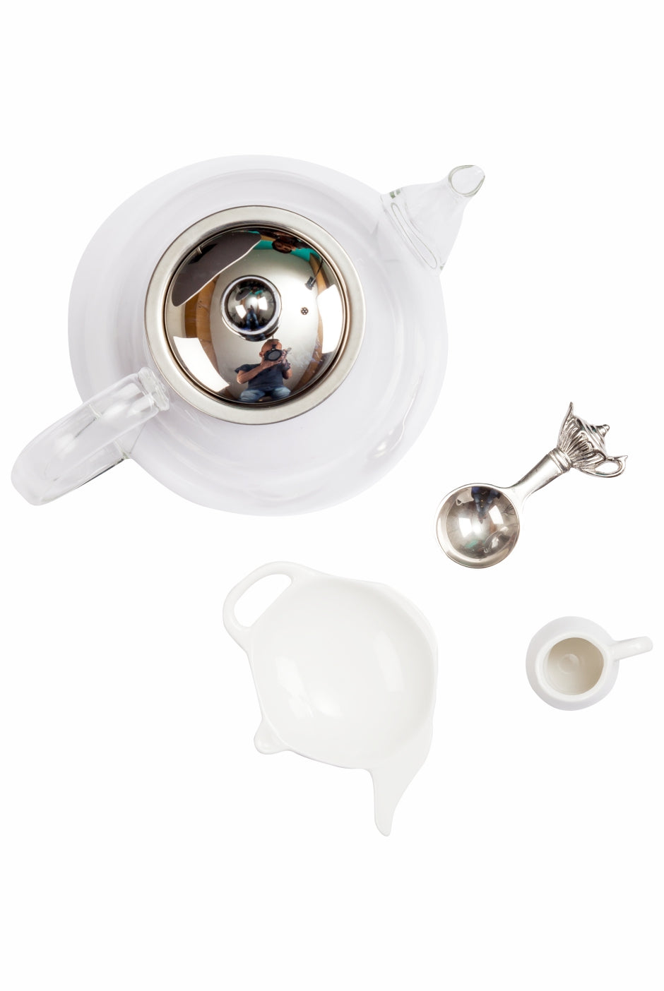 Tea Starter Kit:An elegant selection of our finest sip ware & brewing equipment to make sure tea time is to celebrate and rejoice. We start with a Perfect Tea Measuring Spoon that aids you in using the correct amount of tea leaves, a high quality Borosilicate glass tea pot with a high grade stainless steel tea infuser, a thoughtful tea tidy to make place the tea infuser once the tea is brewed and a cute little personal milk pot